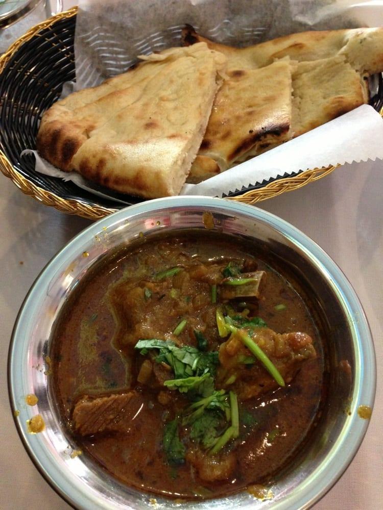 Goat Curry · Tender pieces of boneless lamb and cooked in lightly spiced curry gravy. Served with basmati rice.