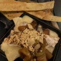 Baked Brie · Caramelized apples, french brie, marcona almonds & honey glaze. Served w/house made crackers
