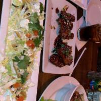 Mini Duck Tacos · Feta, tomato, Napa cabbage, lebni and cilantro ranch.