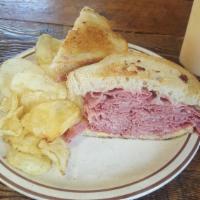 Corned Beef Sandwich · Corned beef sandwich served on rye bread. Ask for it grilled! Add Swiss for an additional ch...