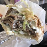 Classic Gyro · Gyro meat is a mixture of seasoned beef and lamb with tomato, onion and lettuce topped with ...