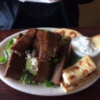 Gyro Salad Plate · Large. Romaine lettuce, tomato, cucumber, red onion and feta cheese topped with gyro meat an...