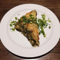Spanakopita · Spinach and feta cheese wrapped in phyllo.