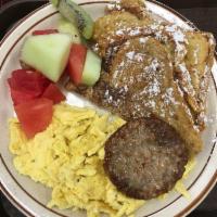 French Toast · Two slices of French toast served with two eggs any style, fruit, and sausage.