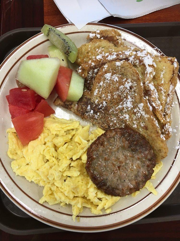 French Toast · Two slices of French toast served with two eggs any style, fruit, and sausage.
