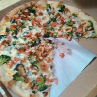Chicken Vegetable Pizza · Chicken cutlet sauteed in garlic with broccoli, spinach, and tomatoes.