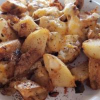 Spuds · Fresh sliced potatoes grilled with onions, green peppers, and our special seasonings.