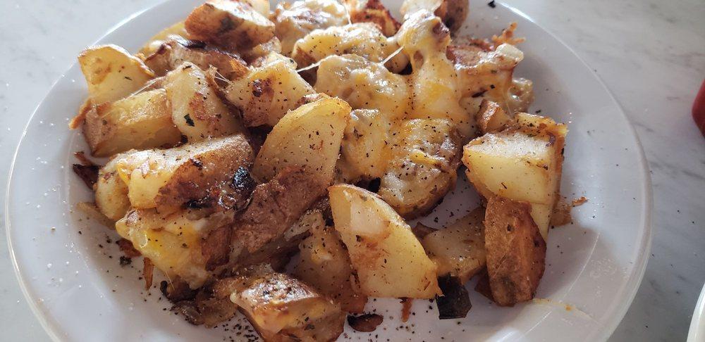 Spuds · Fresh sliced potatoes grilled with onions, green peppers, and our special seasonings.