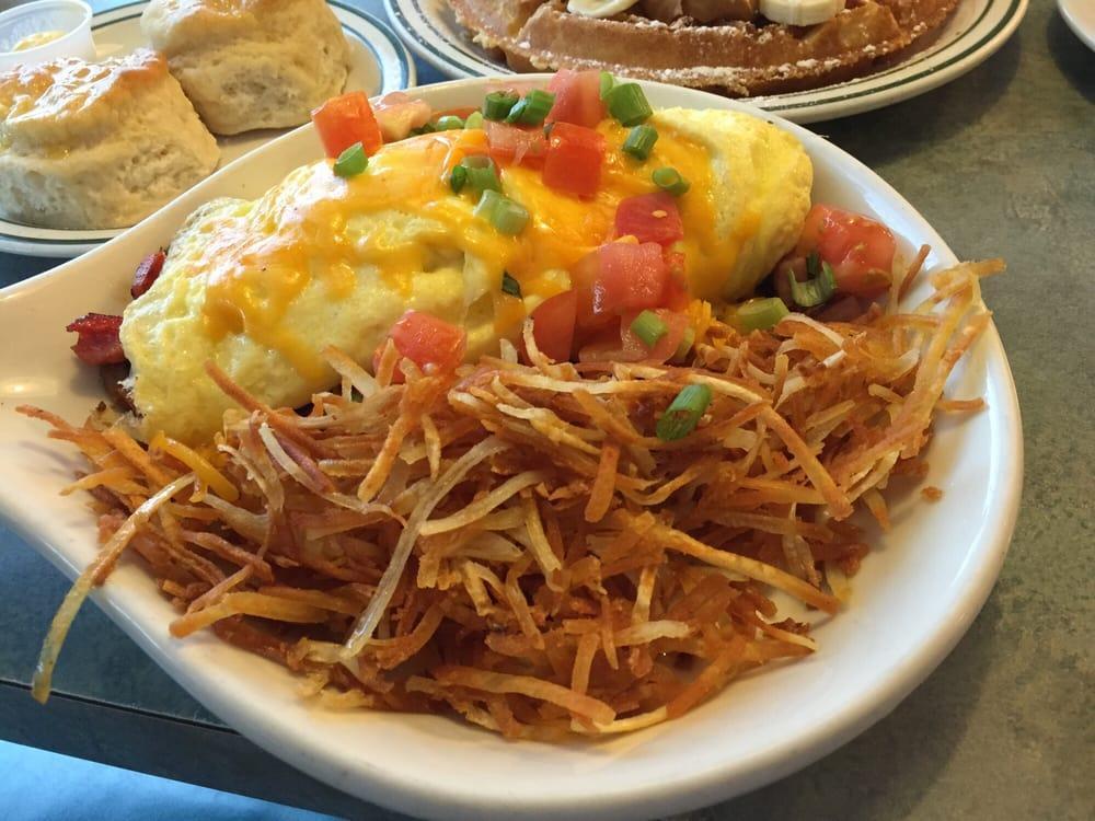 Meat Lovers Omelette · Ham, bacon, sausage, onions, bell peppers, mushrooms, tomatoes, green onions, cheddar cheese.
