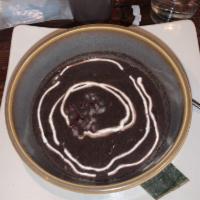 Black Bean Soup · Rich and slow-simmered flavors, red onions,
sour cream
