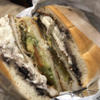 Tortas · Chicken cutlet or beef, lettuce, tomato, beans, oaxaca, cheese, mayo, jalapenos and avocado.