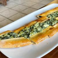 Spinach Pide · Spinach with onions and feta cheese.