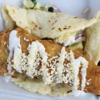 Crispy Fish Tacos · Modelo beer-battered cod, cilantro, citrus jicama pineapple slaw, and sesame. Served with ri...