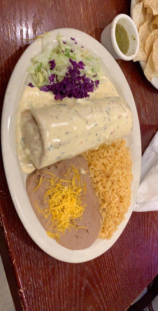Special Chimi · Your choice of meat wrapped in a large flour tortilla, deep fried and topped with spinach cheese sauce. Served with rice and beans.
