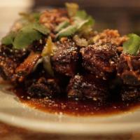 Sticky Spare Ribs · Pork ribs, 5 spice caramel, pickled Serrano chili and roasted rice.