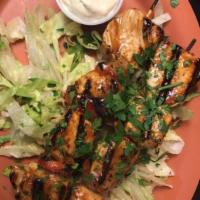 Chicken Kabob · 2 skewers of tender chicken pieces marinated in lemon pepper, olive oil, spices with grilled...