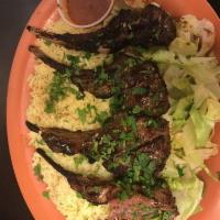 Lamb Chops · Rack of lamb chops marinated and grilled to perfection. Includes a house salad and Italian d...