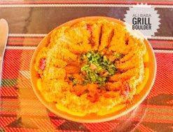 Muhamara · A puree of walnut, red bell peppers, cracked wheat, onion and lemon juice. Topped with olive...