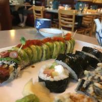 Ken Zaburo Maki · Special house roll. Tuna, hamachi, salmon and king crab with spicy sauce, tempura style.