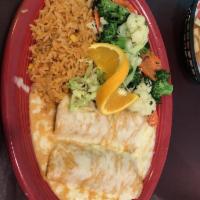Enchilada · A fresh corn tortilla filled with your choice of cheese, carnitas, shredded beef or shredded...