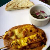 Satay · Tender chunks of skewered chicken grilled, served with peanut sauce and cucumber relish. Mild.