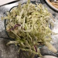 Cabbage Salad · Cabbage, vinegar, olive oil, and
 spices.