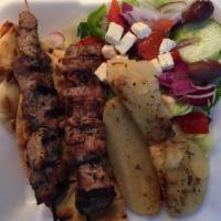 Pork Souvlaki Platter · Grilled pork tenderloin. Served open faced with Greek salad, pita, and choice of Greek potat...