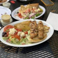 Chicken Souvlaki Platter · Grilled marinated chicken. Served open faced with Greek salad, pita, and choice of Greek pot...