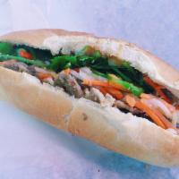 Grilled Pork · Includes mayo, pickled carrots and daikon, sliced jalapeno peppers, cucumber, onions and cil...