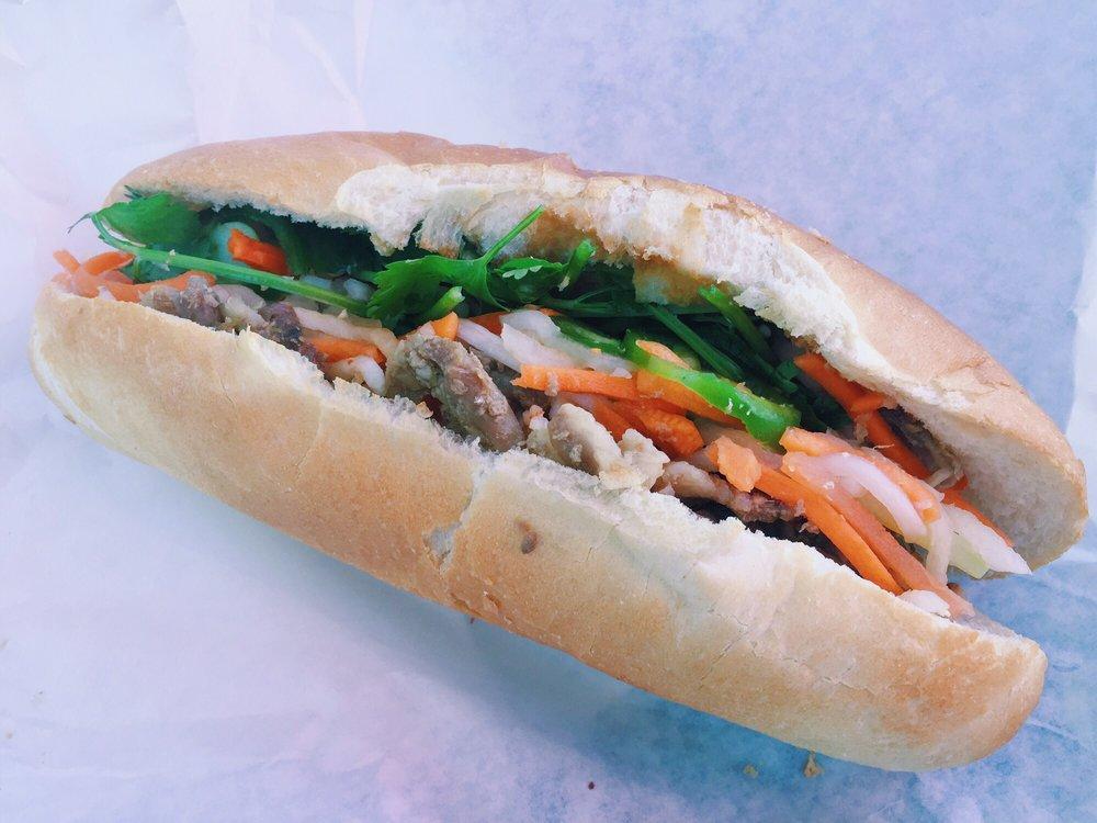 Grilled Pork · Includes mayo, pickled carrots and daikon, sliced jalapeno peppers, cucumber, onions and cilantro. Spicy.