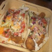 Fish Tacos · 2 pieces. Fresh fried grouper, shredded cabbage, pico de gallo, mixed cheeses and spicy crea...