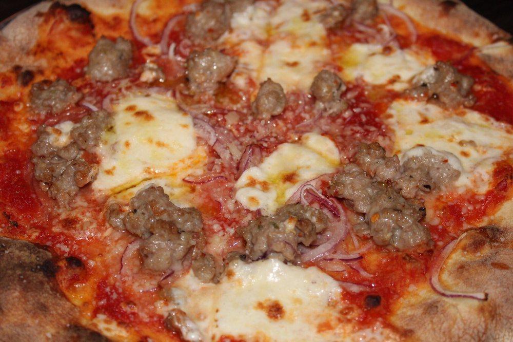 Italian Sausage Pizza · Red sauce, crumbled house made Italian sausage, sliced onion and mozzarella.