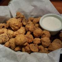 Fried Mushrooms · Zesty battered fresh button mushrooms lightly fried and served with a side of ranch dressing.