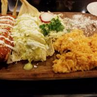 Tamales · Served with rice and beans. Two chicken tamales with green salsa, or two shredded beef tamal...