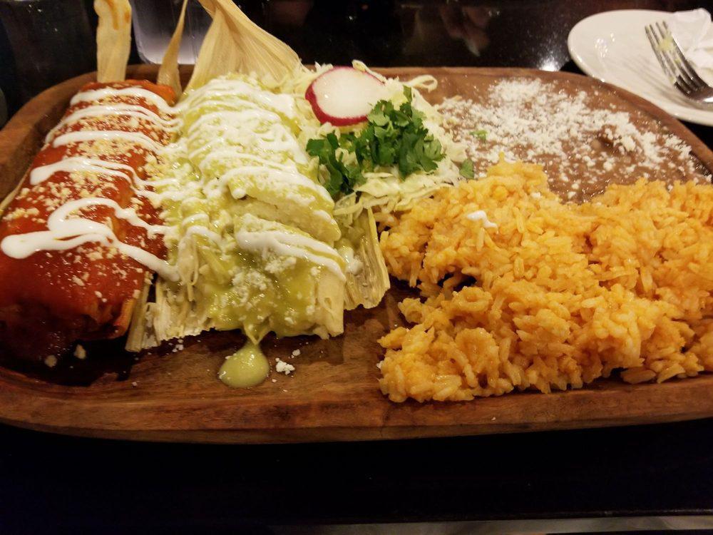 Tamales · Served with rice and beans. Two chicken tamales with green salsa, or two shredded beef tamales with red salsa, served on corn husks and topped with Mexican sour cream and cheese.