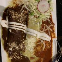 Enchiladas Verdes · Three enchiladas filled with shredded beef or shredded chicken, and smothered with red guaji...