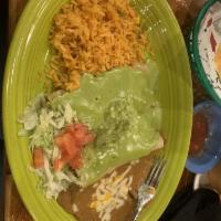 Avocado Enchiladas · 2 shredded chicken enchiladas topped with avocado cream sauce and guacamole served with lett...