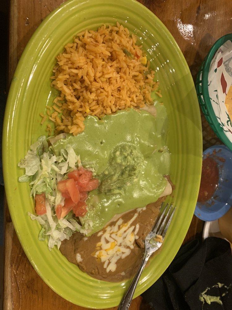 Avocado Enchiladas · 2 shredded chicken enchiladas topped with avocado cream sauce and guacamole served with lettuce, tomatoes, rice and your choice of beans.