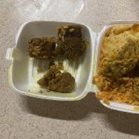 Curry Goat · Braised and simmered in a curry sauce with potatoes and herbs. Served with a rice and peas, ...