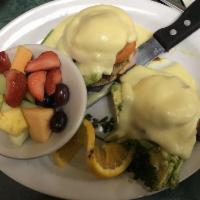 California Benedict · 2 poached eggs, bacon, avocado, and tomato, on a English muffin topped with hollandaise sauc...