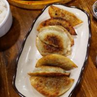 A11-2. Fried Dumplings · Comes with soy sauce.