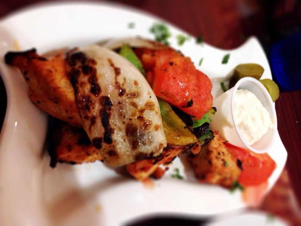 Chicken Kabob · Marinated chicken breast, a blend of spices, paprika, onion, olive oil, yogurt parsley and topped with grilled bell peppers