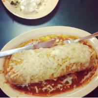 Wet Burrito · Meat, rice, beans, onion, cilantro, red sauce, guacamole, cheese, sour cream, covered in red...