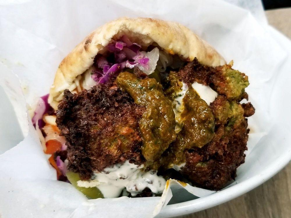 Falafel Sandwich · Our signature sandwich with choice of toppings or 