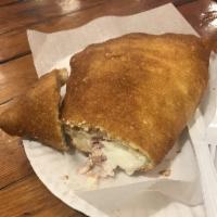 Deep Fried Calzone · Stuffed with ricotta cheese, mozzarella and ham. Served without ham on Fridays.