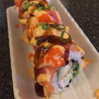 Queen's Roll · Shrimp tempura, crab, eel and veg in a roll topped with tuna and salmon, fish eggs and spicy...