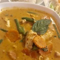 Panang Curry · Green beans, carrots and basil in panang curry paste with coconut milk. Spicy.
