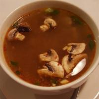 Tom Yum Soup · Hot and sour broth with mushrooms, lemongrass, lime juice and green onions. Spicy.