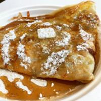 The Maple Dream Crepe · Egg, cheddar and bacon, topped with powdered sugar, butter and maple syrup.