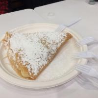 Nutella Banana Crepe · Sliced banana drizzled with nutella and topped with powdered sugar.